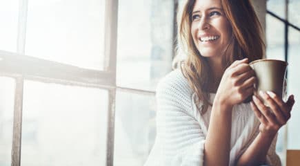 women-smiling-with-coffee-cup