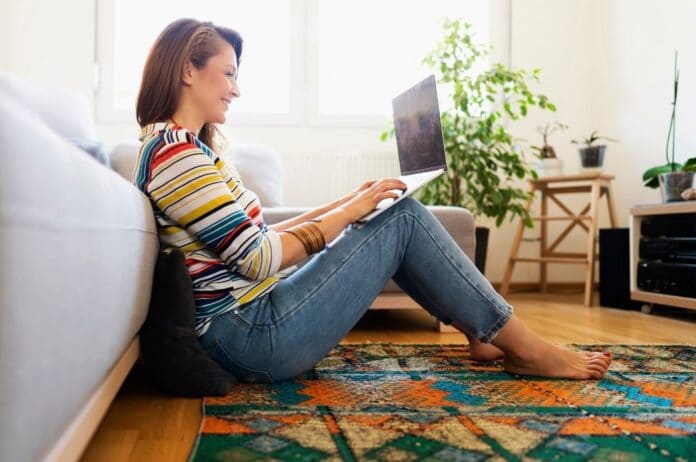 woman-sitting-on-floor-on-laptop