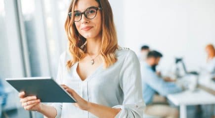 woman-holding-tablet-looking-up