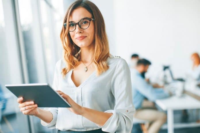 woman-holding-tablet-looking-up