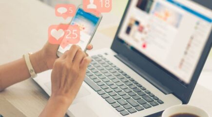 person-using-social-media-on-laptop